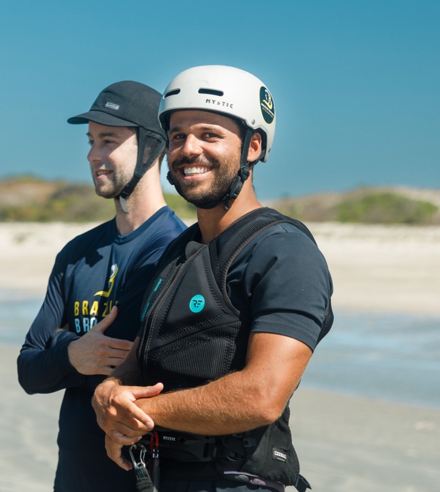 Rubens smiling on the beach in a helmet and impact vest