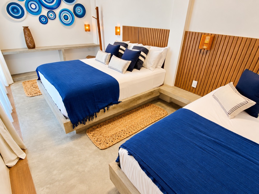 Shared room with two double beds and wooden headboards